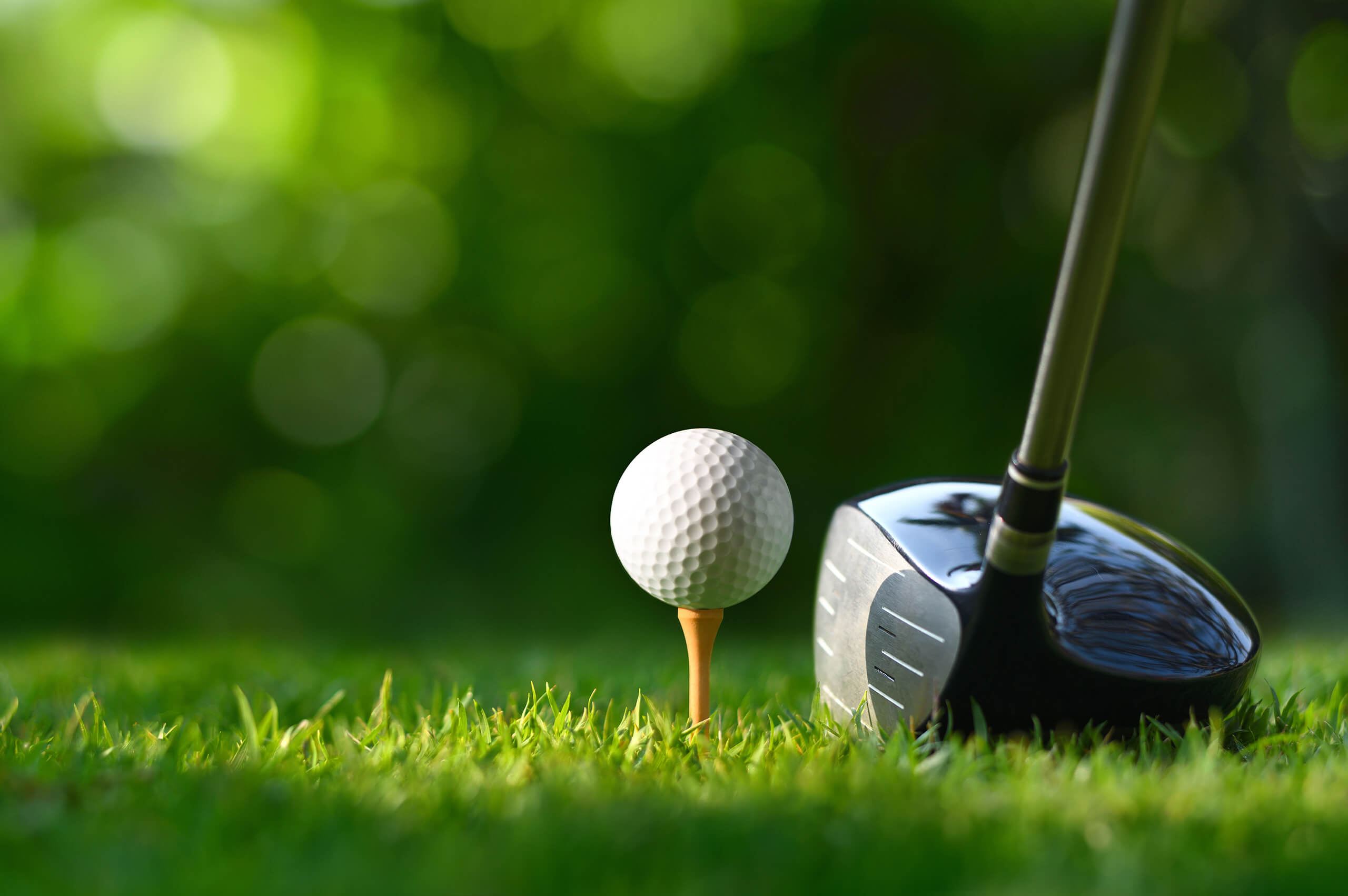 Closeup Shot of Golf Ball on Tee With Club